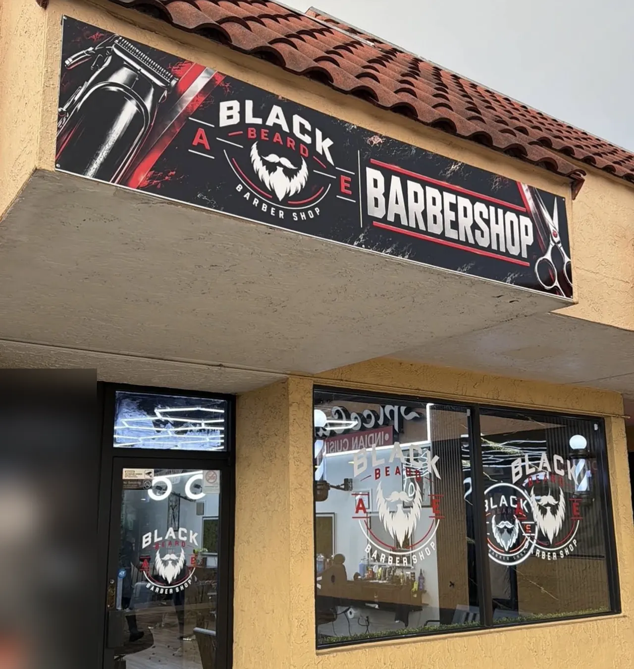 Black Beard Barbershop storefront with red and black signage